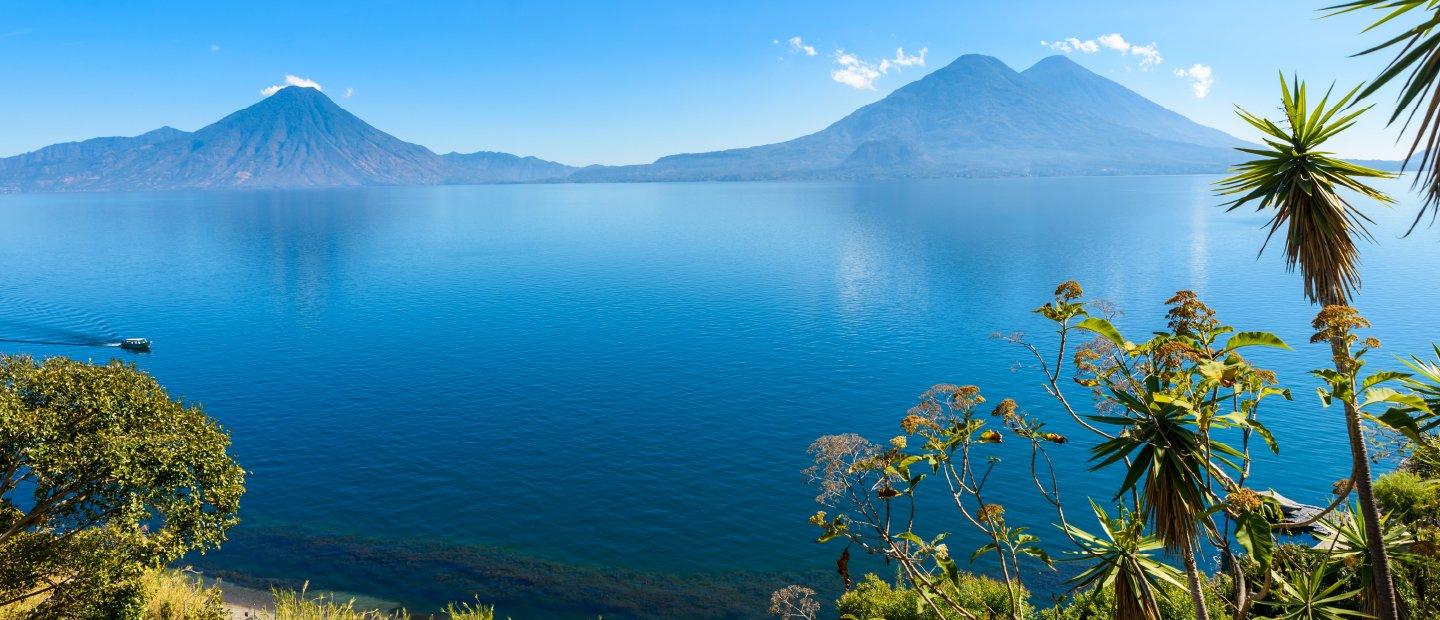 A lake with mountains in the background in Guatemala.